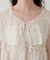 小花柄前リボンラッフルブラウス